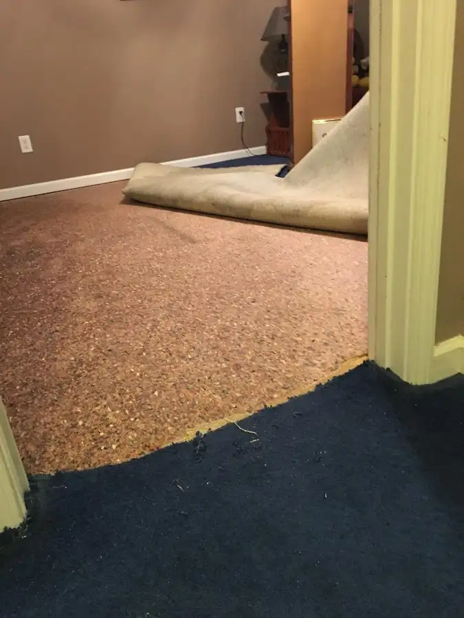 Carpet pad removal revealing water damage during Drying & Dehumidification in Coos Bay